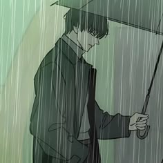 a man holding an umbrella in the rain