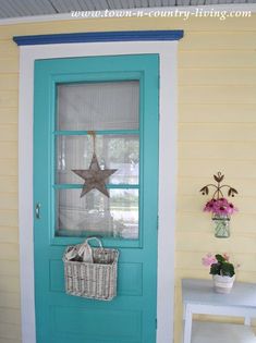 a blue front door with a basket on it