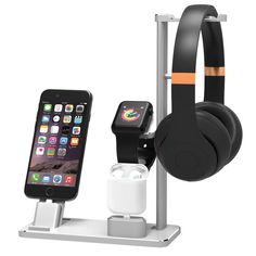 an iphone and headphones are attached to a stand