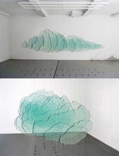 two photographs of an abstract cloud in a white room