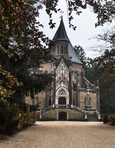 an old building with a steeple on the top