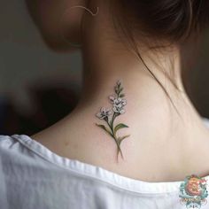 a woman with a flower tattoo on her neck