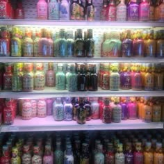 the shelves are filled with many different types of sodas