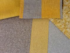 several different colors of fabric are shown together in this image, including yellow and grey