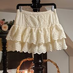 Rare And Hard To Find Loveshackfancy Eyelet Mini Skirt Ivory Size Medium (Fits Like A Small To Medium) Perfect Condition White Mini Skirt With Ruffle Hem, Chic Cream Skirt With Lace Trim, White Feminine Skirt With Ruffles, Feminine White Skirt With Ruffle Hem, White Ruffled Feminine Skirt, Cream Ruffled Tiered Mini Skirt, Cream Tiered Ruffled Mini Skirt, Feminine White Ruffled Skirt, White Mini Skirt With Ruffle Hem For Spring