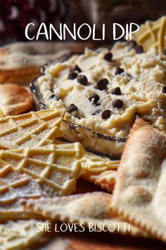 the cover of cannoli dip with chocolate chips on top and crackers around it