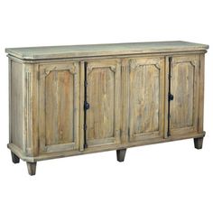 an old wooden sideboard with three doors and two drawers on the bottom, against a white background