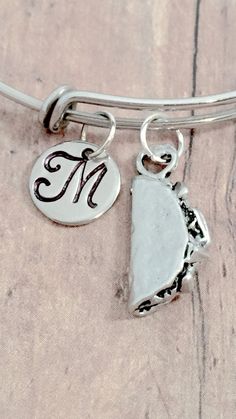 "This listing is for a hand-stamped initial bangle featuring a 4/5\" x 2/5\" pewter taco charm & 3/10\" stainless steel initial pendant. The stainless steel bangle measures 65mm (2.5\") in diameter and fits most adult women's wrists. All items are lead & nickel free. Please message me with any questions, thank you! Add an initial to any item: https://www.etsy.com/listing/170461597/add-an-initial?ref=shop_home_active&ga_search_query=Add Add a birthstone to any item: https://www.etsy.c Adjustable Stamped Jewelry For Best Friend Gift, Personalized Novelty Silver Bracelets, Personalized Silver Novelty Bracelets, Personalized Novelty Silver Bracelet, Adjustable Novelty Jewelry For Best Friend Gift, Personalized Novelty Jewelry For Friendship, Novelty Personalized Jewelry For Friendship, Nickel Free Novelty Bracelet Jewelry, Adjustable Silver Novelty Jewelry