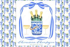 a blue and white vase with two champagne glasses