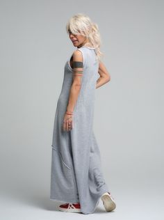 Our grey maxi dress is the epitome of laid-back chic, made from soft viscose that drapes beautifully for a comfortable yet stylish look. Its sleeveless design and subtle scoop neckline offer a casual elegance that's perfect for sunny days or layered under a jacket when the evening cools down. FEATURES:Sleeveless with a relaxed fit and a long, flowing silhouette. Ideal for leisurely weekend wear or as a base for accessorizing100% Handmade. SIZE & FIT: Fit: A relaxed fit with room to moveModel is wearing size Small or S/M View our SIZE CHART before ordering MATERIALS & CARE: Content: 65% Cotton, 35% Polyester Care: Machine wash on cold (30ºC) with a mild detergent. SHIPPING: Made to order, the processing time is 15 working days This item will be shipped via DHL Casual Sleeveless Maxi Dress For Loungewear, Gray Floor-length Maxi Dress, Sleeveless Gray Maxi Dress For Spring, Chic Gray Maxi Dress, Casual Gray Sleeveless Maxi Dress, Grey Maxi, Stocking Fillers For Her, Grey Maxi Dress, Dresses Xxl