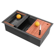 a wooden cutting board with two oranges on it