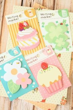 four different types of cards with flowers and cupcakes on them, one is for writing markers