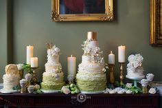 a table topped with lots of different types of cakes