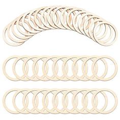 a set of wooden circles and rings on a white background