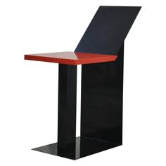 a modern black and red table with an open shelf in the middle, on a white background