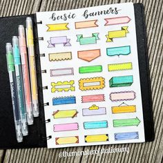 an open planner with markers and marker pens