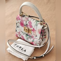 Furla 1927 Top Handle Mini Toni Talco New Without Tags. Never Worn. Perfect Condition. Exterior: 100% Leather Dimensions: 8.27 X 6.3 X 3.35 (W X H X D) Luxury Spring Bag With Top Carry Handle, White Shoulder Bag With Top Handle As Gift, Luxury Rectangular Spring Bag, Luxury Spring Bags With Detachable Strap, White Shoulder Bag With Gold-tone Hardware As Gift, Luxury Bags With Detachable Strap For Spring, Luxury Spring Bag With Removable Pouch, Luxury White Bag With Top Carry Handle, White Bags With Gold-tone Hardware For Gifts