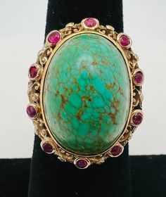 Antique 14K Yellow Gold Turquoise Ruby Cocktail Ring Size 6 A perfect gift for your loved one for any special occasion or holiday!  Total Ring Weight: 9.24g Ring Length: 31.76mm Ring Width: 19.08mm Ring Size: 6 Item will be placed in a gift box. * Elegant Turquoise Gemstone Ring For Formal Occasions, Collectible Multi-stone Turquoise Oval Ring, Gold Turquoise Ring For Formal Occasions, Elegant Yellow Gold Turquoise Ring For Formal Occasions, Formal Gold Turquoise Ring, Fine Jewelry, Formal Gold Turquoise Ring Fine Jewelry, Formal Gold Turquoise Ring In Fine Jewelry Style, Luxury Turquoise Cabochon Ring, Luxury Turquoise Anniversary Ring