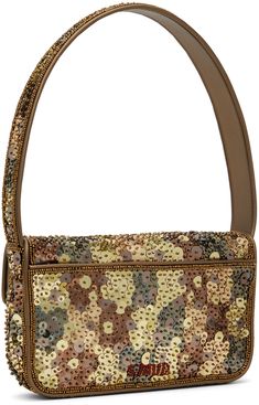 Hand-beaded and sequinned shoulder bag in gold tone. · Grained faux-leather trim throughout · Fixed shoulder strap · Beaded logo at back face · Patch pocket · Magnetic press-stud flap · Zip pocket at interior · Satin lining · H6 x W10.5 x D2.25 Supplier color: Gilded sequins Designer Rectangular Staud Shoulder Bag, Designer Staud Rectangular Shoulder Bag, Staud Luxury Bags, Designer Staud Leather Bags, Chic Rectangular Sequined Shoulder Bag, Chic Brown Staud Bags, Staud Tommy Beaded Bag, Tommy Beaded Bag, Glamorous Gold Beaded Shoulder Bag