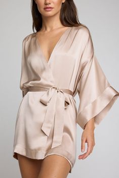 Luxurious and silky. This is elevated loungewear. A luxurious 100% silk kimono-style mini robe that drapes without effort and doesn't cling. *411* Use this as a guide. Preference is a huge factor — if you’re near the top of a size range and/or prefer more coverage, you may want to size up. Features a sleek drop kimono-inspired sleeve with a double cuff and light ruching on the shoulder for extra fullness. Short mini length. Finished with french seams, internal ties to hold garment in place, and Short Silk Robe, Victoria Secret Robe Silk, Silk Pijamas, Nye 2024, Elevated Loungewear, Silk Bathrobe, Silk Robes, Silky Robe, Silk Clothing