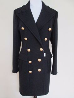 Balmain Coat 100% Authentic, purchased at Barney's Condition: New with Tags Size: French 42, US 10 The coat is the classic double breasted coat in black wool/cashmere blend. It has the iconic large gold tone buttons at the front. It has the iconic structured fit and shoulders and pockets at the front. Retail $4995. Coat measures approximately lying flat: bust-21", waist-18", sleeve length from shoulder seam to end-26", and length from the top of the shoulder to the hem-37" Comes from a smoke and Designer Tailored Outerwear With Gold Buttons, Luxury Long Sleeve Pea Coat With Button Closure, Designer Long Sleeve Pea Coat With Button Closure, Luxury Double-breasted Blazer With Horn Buttons, Luxury Black Blazer With Button Cuffs, Designer Blazer With Horn Royal Black Buttons For Winter, Formal Fitted Pea Coat With Button Cuffs, Luxury Office Outerwear With Gold Buttons, Luxury Black Blazer With Button Closure