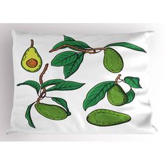 a pillow with avocados and leaves on the front, along with a white background