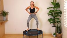 a woman standing on top of a trampoline