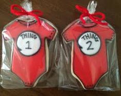 two decorated cookies in the shape of dr seuss's thing 1 and 2