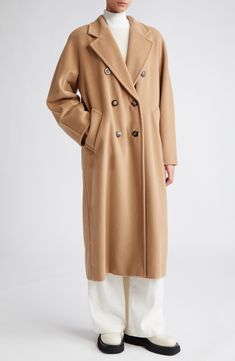 Expertly hand-stitched in the softest virgin-wool-and-cashmere blend, this long coat is a classic with a straight silhouette cinched by a waist-defining belt. 48" length (size 8) Double-breasted button closure Notched lapels Front welt pockets Removable tie belt Lined 90% virgin wool, 10% cashmere Dry clean Made in Italy Designer Clothing Classic Long Wool Coat In Neutral Color, Classic Long Neutral Wool Coat, Beige Long Cashmere Wool Coat, Elegant Long Camel Wool Coat, Classic Long Beige Wool Coat, Designer Clothing Brands, Long Wool Coat, Camel Coat, Collared Coat