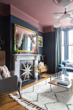 a living room filled with furniture and a fire place