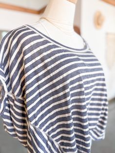 A gal can never have too many striped tees in her closet! This Nylah Top is perfect for a relaxed and simple outfit for the days running errands. With a scoop neckline and a soft blue denim color, the pairings are endless! Pair the Nylah Top with some jeans, sneakers and a denim jacket and top it off with a trucker or dad cap! :) The deets!: relaxed fit rolled cap sleeve true to size Specs taken from size Medium: Bust: 33" Length: 20.5" Material: 65% Cotton // 35% Polyester Relaxed Striped Summer Tops, Relaxed Striped Tops For Summer, Everyday Summer Top With Horizontal Stripes, Everyday Summer Tops With Horizontal Stripes, Summer Tops With Horizontal Stripe Pattern For Everyday, Casual Horizontal Stripe Everyday Tops, Relaxed Striped Tops For Spring, Casual Tops With Striped Hem For Everyday, Spring Striped T-shirt For Loungewear