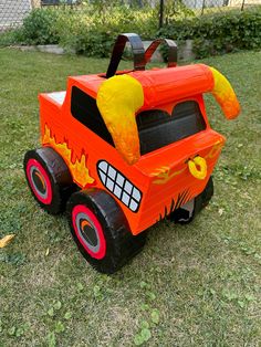 an inflatable fire truck is sitting on the grass