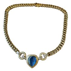 A timeless handcrafted 18 K cuban link Necklace set with a pear shape blue Sappire Cabochon weighing approximately 10 ct, surrounded by brilliant cut Diamonds. Very nice workmanship, solid 18 K yellow Gold. Length: 41 cm. Weight: 97.20 grams. The individual cuban link is 0.75 cm wide. Dimension of pendant part: 2.70 cm x 2.30 cm. QUESTIONS? Contact us right away if you have additional questions. We are here to connect you with beautiful and affordable antique and estate jewelry. Masterfully hand Message Center, Cuban Link Necklace, Blue Sapphire Diamond, Cuban Link, Sapphire Diamond, Link Necklace, Pear Shape, Brilliant Cut Diamond, Estate Jewelry