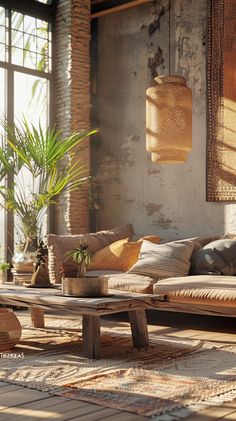 a living room filled with lots of furniture next to a large window and potted plant