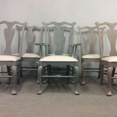 six chairs are lined up in front of a wall with the words supervisor interiors on it