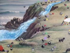 a painting with animals and flowers on the side of a hill next to a body of water