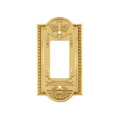 an ornate light switch plate cover in gold