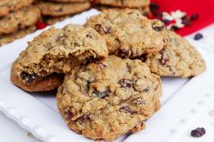 chocolate chip cookies on a white plate next to other cookies