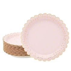 two pink plates sitting next to each other