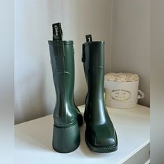 Rare Find Chloe Betty Pvc Rain Boots Size: Eu 36 Color: Forest Green Condition: New Comes With: Boots, Original Dust Bags (I Have The Original Box But It Would Be Big To Ship With Boots) Authenticity: Please Refer To Uploaded Order Receipt Trendy Green Boots For Outdoor, Green Flat Heel Winter Boots, Chic Green Boots With Round Toe, Green Platform Boots With Round Toe, Green Rain Boots With Round Toe For Spring, Trendy Green Square Toe Boots, Green Boots With Reinforced Heel And Square Toe, Green Square Toe Boots With Reinforced Heel, Chic Green Closed Toe Boots