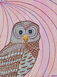 an owl sitting on top of a pink surface