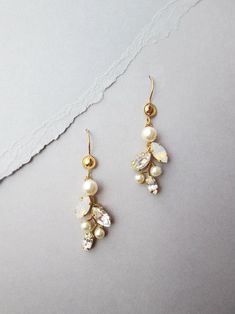 Bridal crystal and pearl earrings Swarovski crystal opal | Etsy Elegant Wedding Cluster Earrings With Ear Wire, Delicate Pearl Drop Dangle Crystal Earrings, Delicate Dangle Crystal Earrings With Pearl Drop, Delicate Dangle Earrings For Mother Of The Bride, Delicate Gold Crystal Earrings With Pearl Drop, Delicate Gold Earrings For Mother Of The Bride, Wedding Drop Earrings With Pearl Charm, Vine Earrings, Earrings Leaf