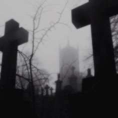 an old cemetery with crosses in the foreground