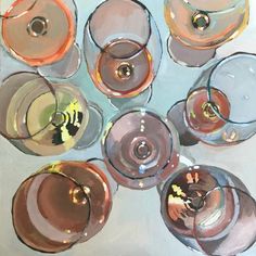 a group of wine glasses sitting on top of a table next to eachother