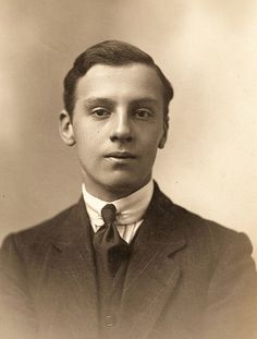 an old photo of a man in a suit and tie