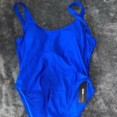 This Is A Blue One Piece Swimsuit Originally Purchased From Fashion Nova. Womens Size Large. The Back Of The Swimsuit Is A Low Back Style. Very Flattering. Never Worn, Brand New With Tags. Royal Blue Sleeveless Swimwear For Summer, Royal Blue Sleeveless Swimwear, Blue Sleeveless Bodysuit For Swimming, Blue Stretch Leotard For Summer, Sleeveless Blue Leotard For Swimming, Blue Sleeveless Leotard For Summer, Blue Lined Bodysuit For Swimming, Blue Sleeveless Summer Leotard, Blue One-piece Bodysuit For Swimming