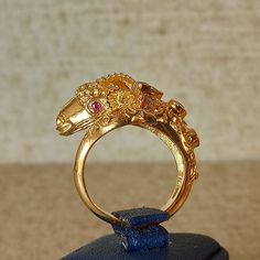 Byzantine style ring with ram head with natural sapphire Emerald, Rubies and Brilliant cut Diamonds, handmade Made of 18 carat solid yellow gold SHIPPING INFORMATION FREE SHIPPING VIA DHL EXPRESS Please fill in an active phone number It's required by the courier company DELIVERY TIME INFORMATION 1 - 3 Days EUROPE 3 - 5 Days to U.S.A and CANADA 5 - 8 Days to AUSTRALIA, SOUTH AMERICA, AFRIKA And to all the other countries around the world Exquisite Gold Ring With Stone Setting, Exquisite Gold Rings With Stone Setting, Luxury Gold Ruby Ring With Intricate Design, Ornate Yellow Gold Hallmarked Ruby Ring, Gold Hallmarked Sapphire Open Ring, Hallmarked Gold Sapphire Open Ring, Formal Gold Gemstone Snake Ring, Gold Sapphire Ring Open Ring Hallmarked, Gold Sapphire Ring With Stone Setting For Formal Events