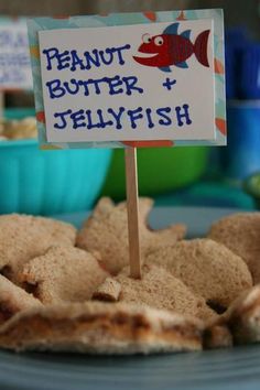 there is a sign that says peanut butter and jellyfish on top of crackers