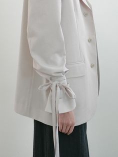 This is a minimal and modern jacket by OWN FEATURE COLOUR.OFC that is made out of high quality and sturdy material. With distinctive mood of the design and comfortable wear, you can style it for your clean daily outfit.- Belt detail on the waist- Relaxed oversized silhouette- Trendy and minimal mood Modern Outerwear With Lapel Collar For Office, Modern Spring Outerwear For Office, Spring Outerwear For Office With Button Cuffs, Modern Blazer With Hidden Button Closure For Spring, Modern Neutral Blazer For Workwear, Modern Spring Blazer With Hidden Button Closure, Modern Neutral Blazer For Work, Modern Spring Outerwear For Business Casual, Modern Beige Blazer For Spring