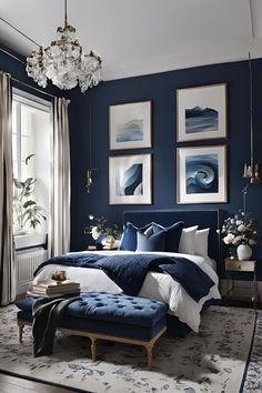 a bedroom with blue walls and pictures on the wall, along with a footstool